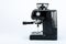 Black manual coffee maker with grinder on a white background, side view