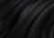 Black material background, elegant luxury material with draped folds and wrinkled creases of smooth wavy silk fabric