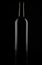 Black matt glass wine bottle, isolated on black
