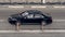Black Mercedes S Class on the city road. Fast moving car on Moscow streets. Vehicle driving along the street in city with blurred