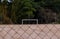 Black mesh on a sand soccer field