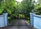 Black metal driveway entrance gates set in brick fence