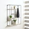 Black metal shelving unit featuring multiple levels of shelves with a variety of potted plants.
