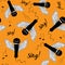 Black microphones with wings and music notes. Sing! Seamless pattern. Vector illustration on orange background