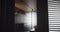 black minimalist style clothing room with large sliding doors and windows
