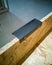Black modern handle. Opened kitchen drawer, kitchen in a bare finishing style from osb board