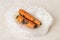 Black mold stains on two raw carrots in a plastic bag on a kitchen table. Fungal mold on rotten carrots. Spoiled fruits and