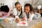 Black Mom And Daughters Painting Spending Time Lying At Home