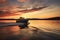 a black motorboat sailing against a sunset background