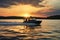 a black motorboat sailing against a sunset background