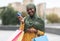 Black Musim Woman Posing With Colorful Shopping Bags And Credit Card Outdoors