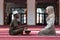 Black Muslim man and woman praying in mosque