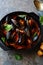 Black mussels in red tomato-wine sauce