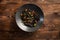 Black noodles with marbled beef on a wooden background