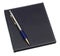 Black note book with ballpoint pen