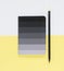 Black notepad and pensil on yellow background. Working place. Space for notes. Top view.