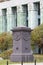 Black obelisk with symbolic bas reliefs in front of Supreme Court of Poland, Krasinski Square, Warsaw, Poland