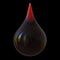 Black oil drop petrol gasoline droplet close-up on black background