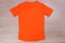 Black orange running tshirt on wooden background