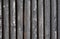 Black painted weathered wooden fence texture