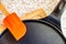 Black pancake smile frying pan on worktop in kitchen