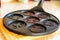 Black pancake smile frying pan on worktop in kitchen