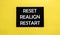 Black pancel write a text Reset Realign Restart on the yellow