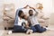 Black parents making symbolic roof of hands above little daughter`s head