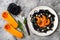 Black pasta with roasted butternut squash, parmesan cheese and fried sage. Halloween black and orange party dinner concept