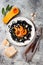 Black pasta with roasted butternut squash, parmesan cheese and fried sage. Halloween black and orange party dinner concept