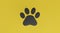 Black paw print on yellow background. Dog or cat paw print. Animal track. pet concept. 3D renderring