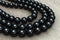 Black pearl three-strand necklace