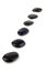 Black pebbles in a row