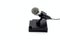 Black pedestal microphone on a white background