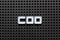 Black pegboard with white letter in word COO abbreviation Chief operating officer