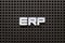 Black pegboard with white letter in word ERP abbreviation of Enterprise Resource Planning