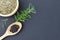 Black pepper grains, fresh rosemary herb and Dried rosemary on black background. Top view. rosemary herb leaves