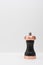 Black pepper mill with copper inserts on white background..