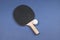 Black ping pong racket isolated on a color background. sport equipment for table tennis