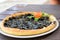 Black pizza. Made with Cuttlefish and black olives.