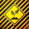 Black Plant icon isolated on yellow background. Seed and seedling. Leaves sign. Leaf nature. Warning sign. Vector