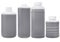 Black plastic bottles 500 milliliters and 1 liter contains material on white background