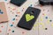 Black plastic case decorated with yellow bead heart