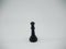 Black plastic queen chess piece isolated on a white background