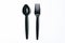 Black plastic spoon and fork for single used on white background