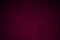 Black plum maroon rough texture background. Toned rough wall. Deep magenta color.