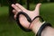 A black poisonous snake wrapped around a man`s arm