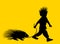 Black porcupine walking with same hair style boy