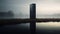 Black Post Tower: A Chromatic Sculptural Slab On A Foggy Lake