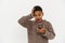 Black preteen boy expressing surprise while using cellphone